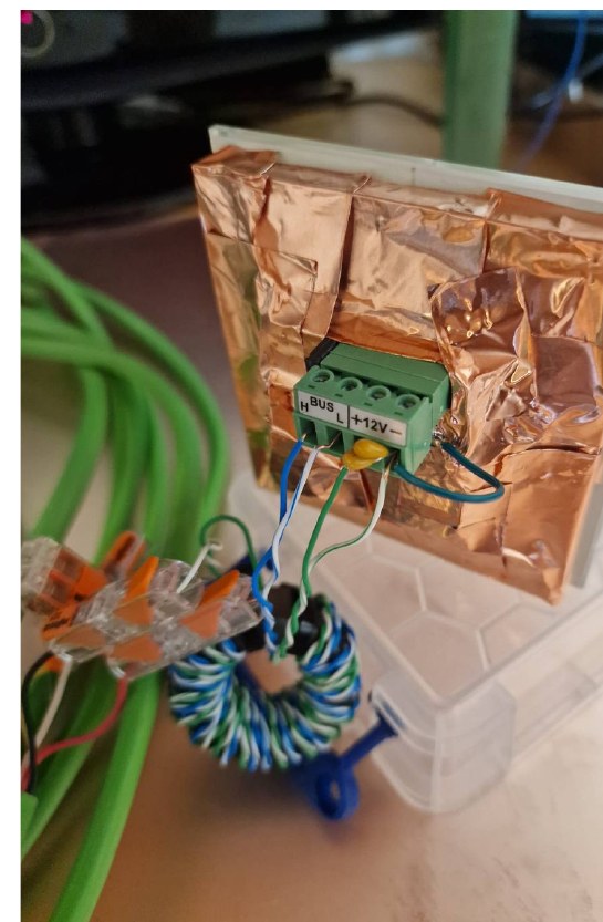 Shielding the back of the module with copper foil, bonded to module ground.